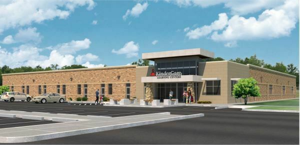 Architectural rendering of future Kindercare building - a single story building with a brick exterior and cement awnings over the glass entrance space